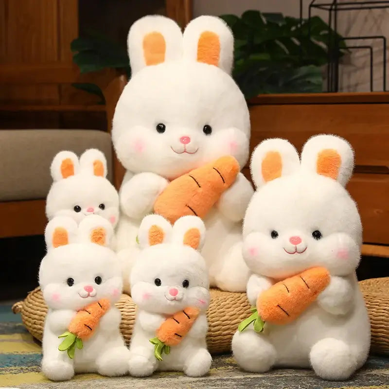 photo de peluches de lapins blanc avec des carottes